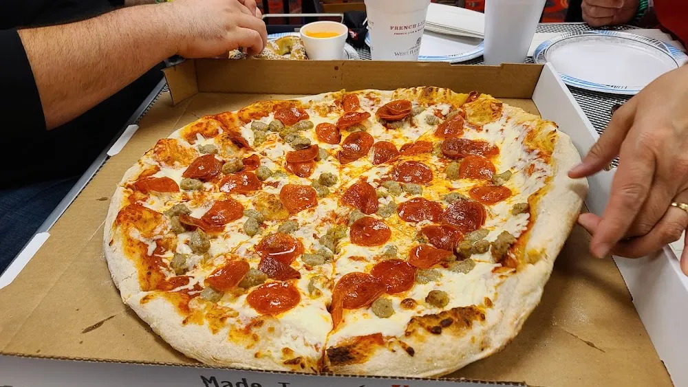 Round Doughy Thing with Sauce Cheese and Meat